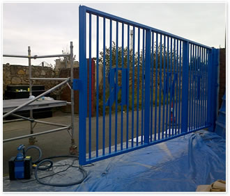 On-site spray painting a gate